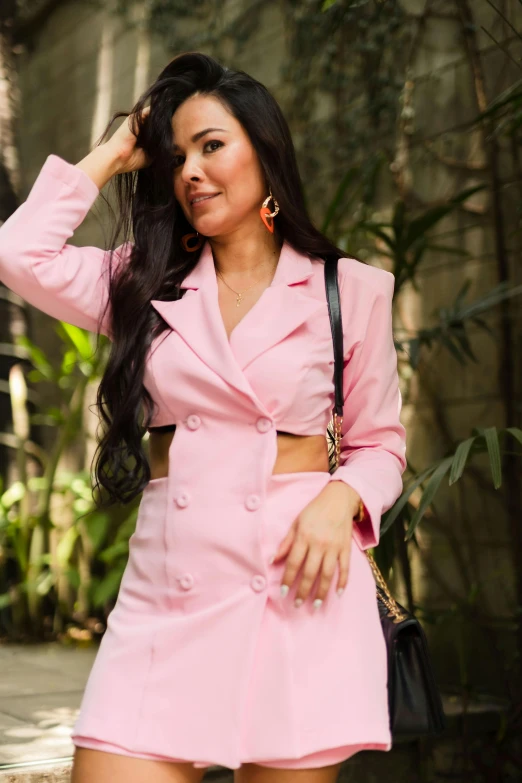 an asian woman with long dark hair is wearing pink