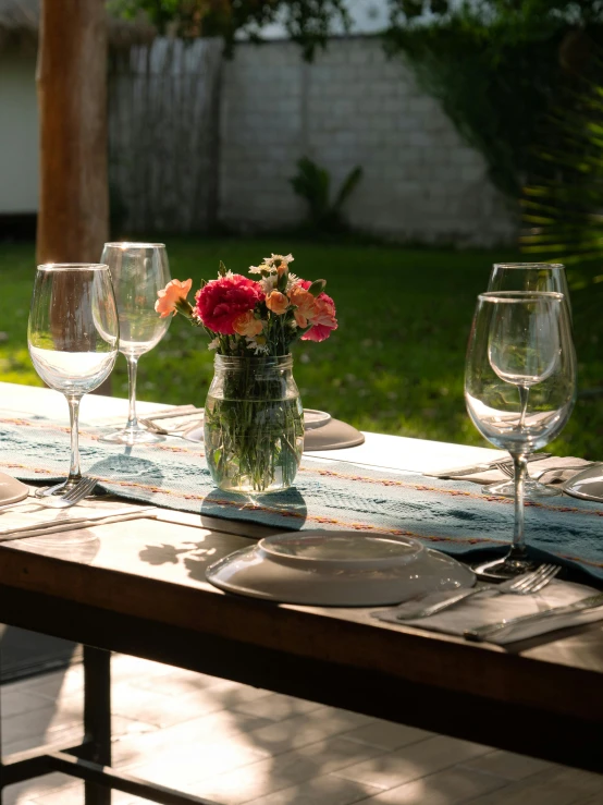 a vase filled with flowers sitting on a table