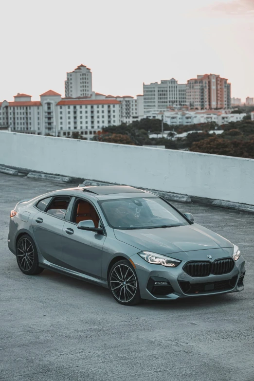 a grey sports car parked on a parking lot