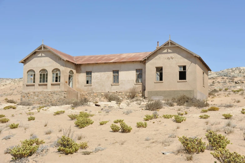 an abandoned church sits in the desert