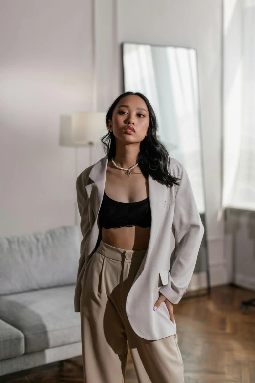 a beautiful woman wearing a white blazer and black top