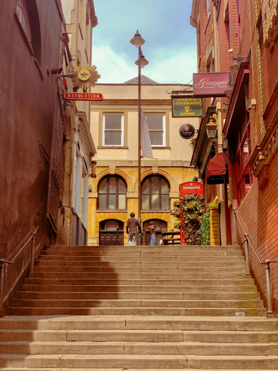 a set of stairs leading to various stores