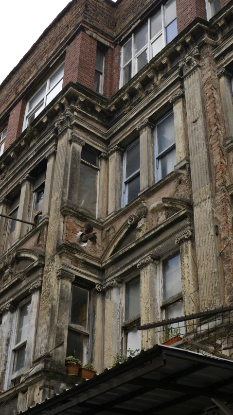 a large building with ornate balcony and many windows