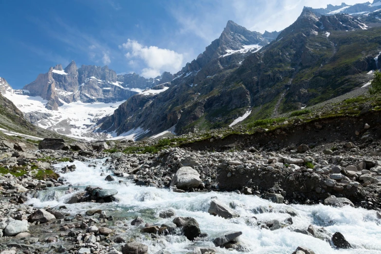 a body of water with a mountain in the background