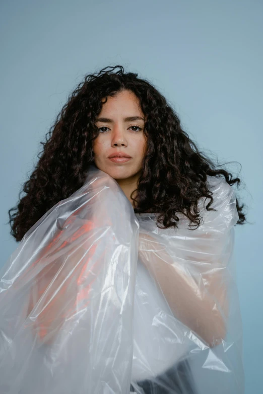 a girl with a plastic bag on her back