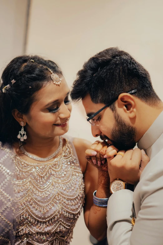 a young couple standing together and smiling