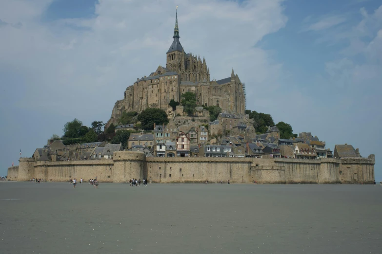 an old building is on top of a hill