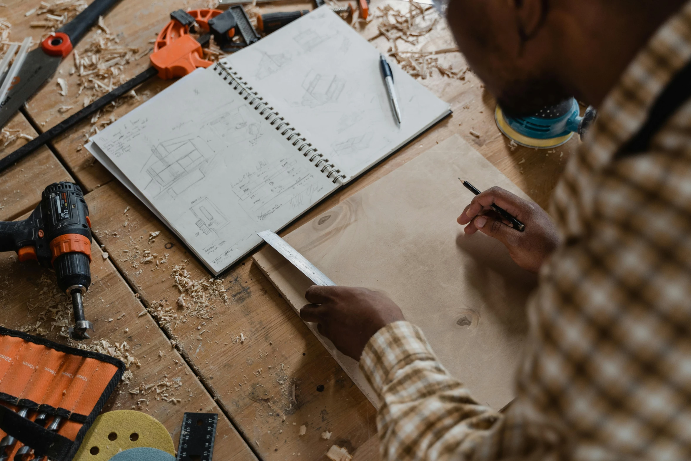 an angle view of a man's workbench with construction items