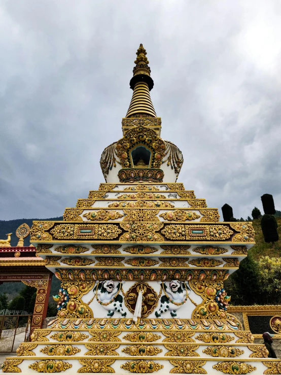 a elaborate yellow and white temple is shown