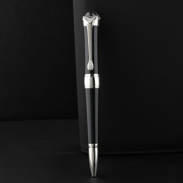 a metal pen on a black background