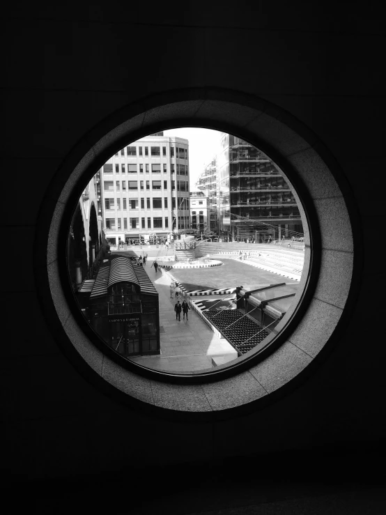 an outside looking view of a city in a round hole