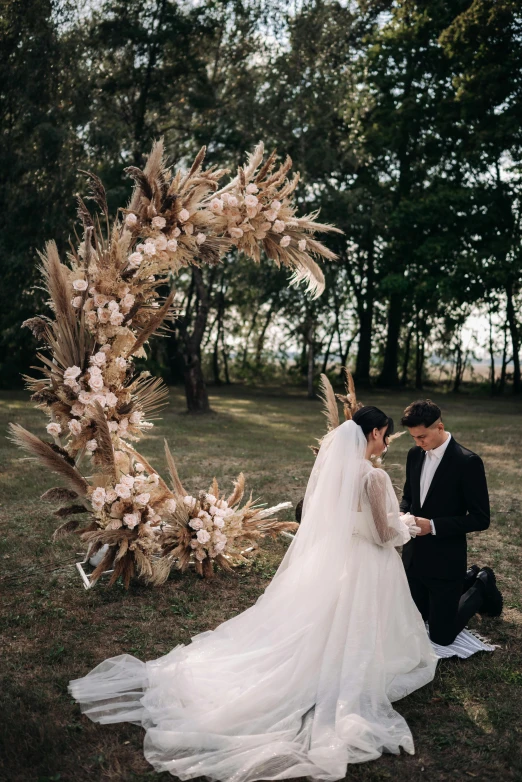 a newly married couple is sitting at the end of their vows