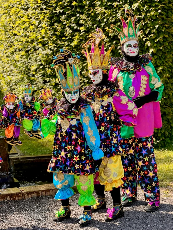 two people in costume are walking down a street