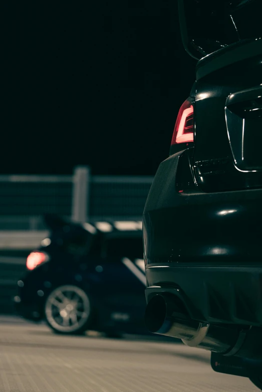 black car parked next to each other on a parking lot