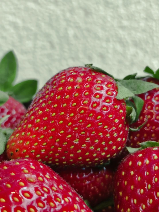 a bunch of strawberrys sitting on top of each other