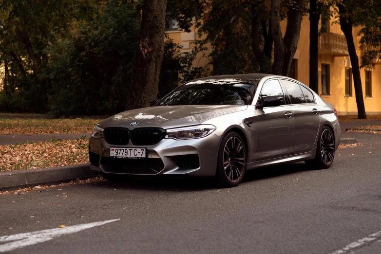 a grey car parked on the side of the road