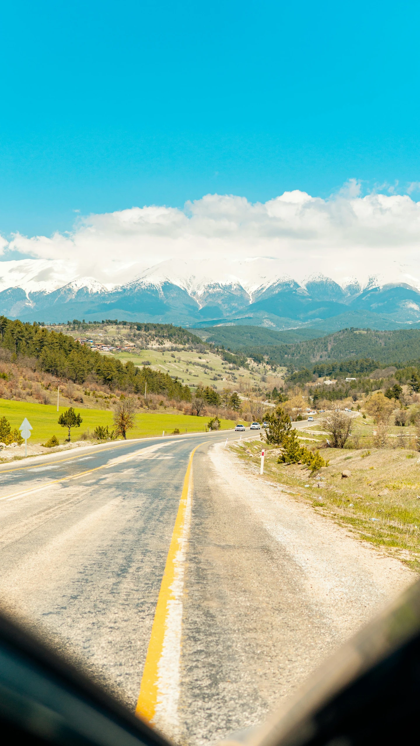 a view of the mountains from inside a car