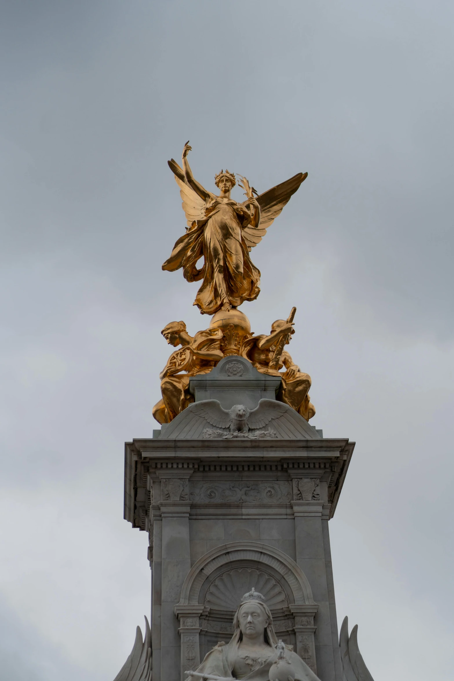 the golden statue atop the tower is in the sky