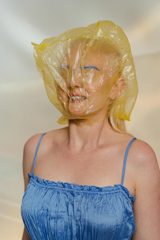 a woman with a plastic bag over her head