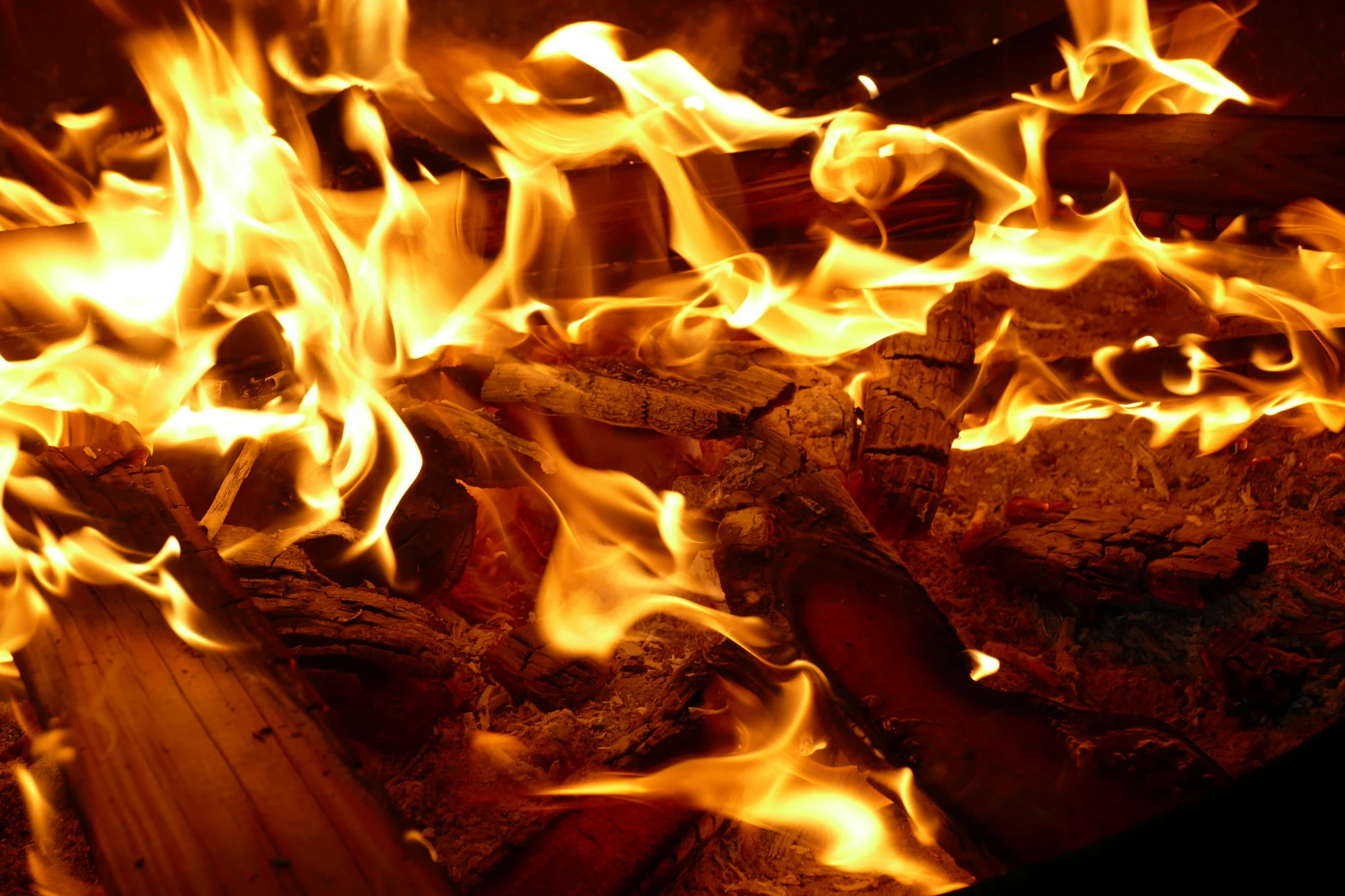 fire flames coming out of a brick oven