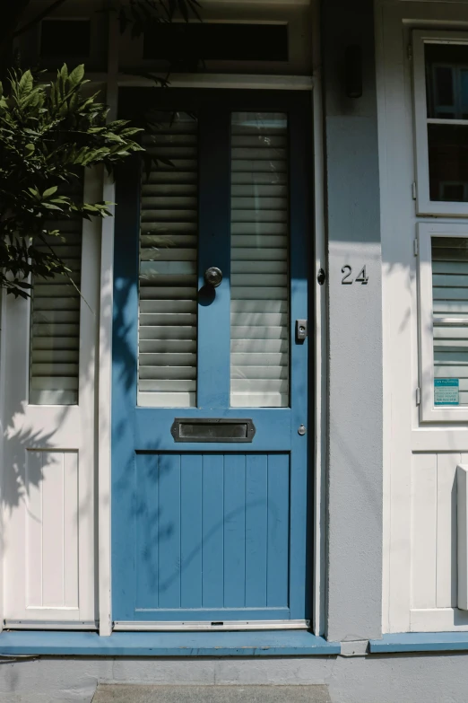 a door that is blue and white on a house