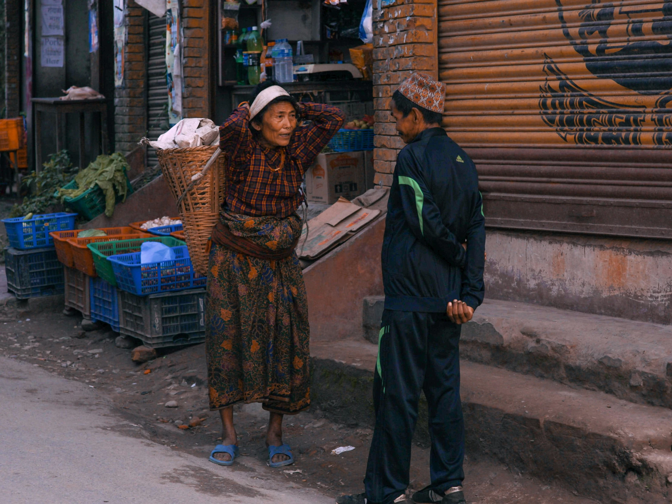 two people standing next to each other in the street