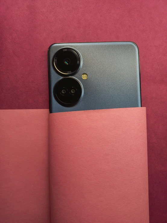 an iphone case with a camera inside and behind it