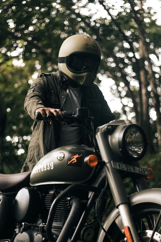 a man in a helmet sitting on top of a motorcycle