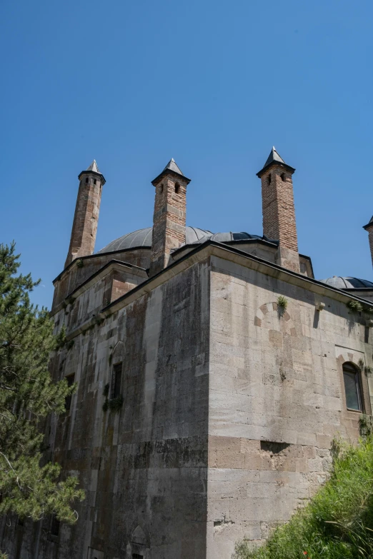 an old building with chimneys and windows