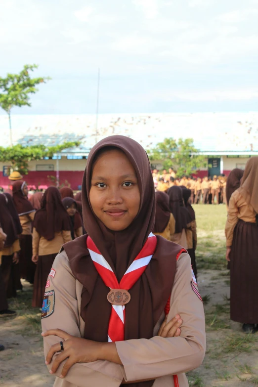 a girl is posing in front of a group