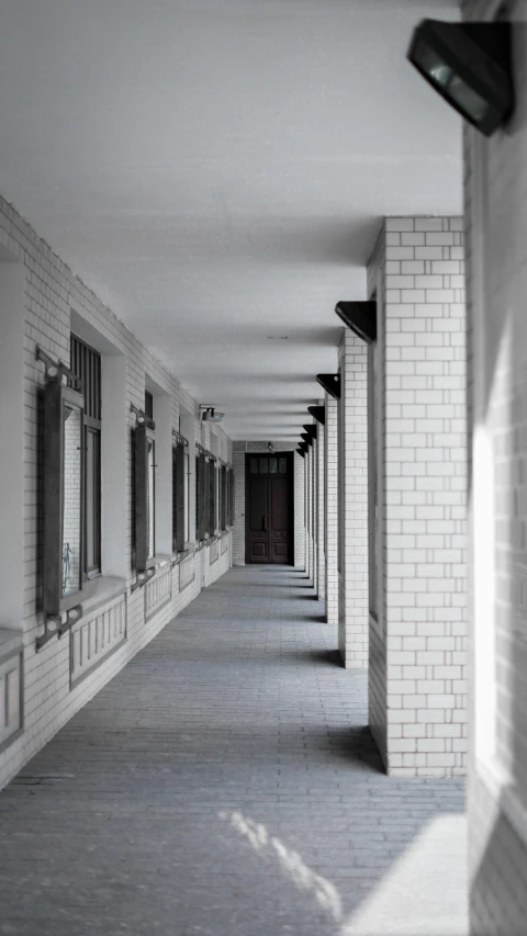 the large long walkway has been paved with windows