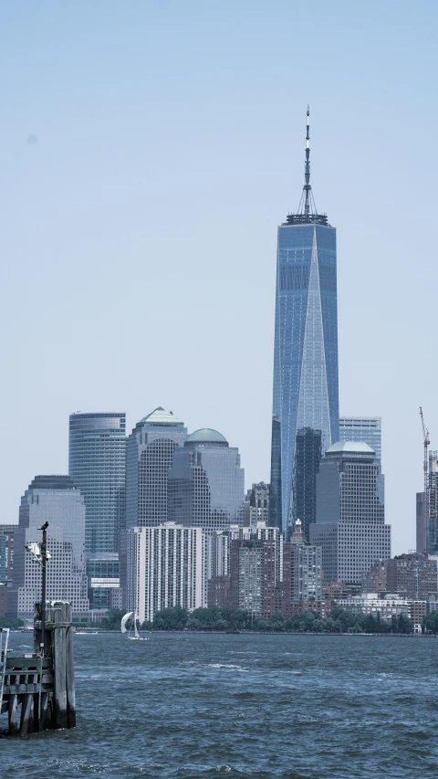 a city skyline with lots of tall buildings and a clock tower