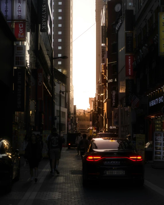 a car driving down the road in a city