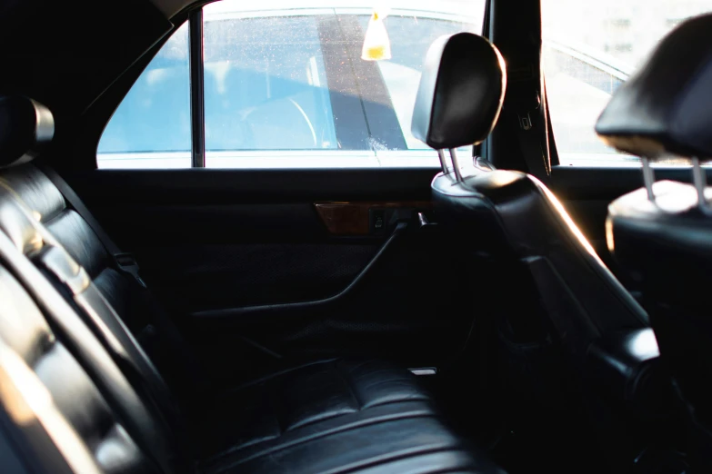 the front seats of an automobile facing a window