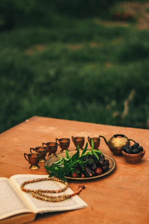 a tray of food and some cups on a table