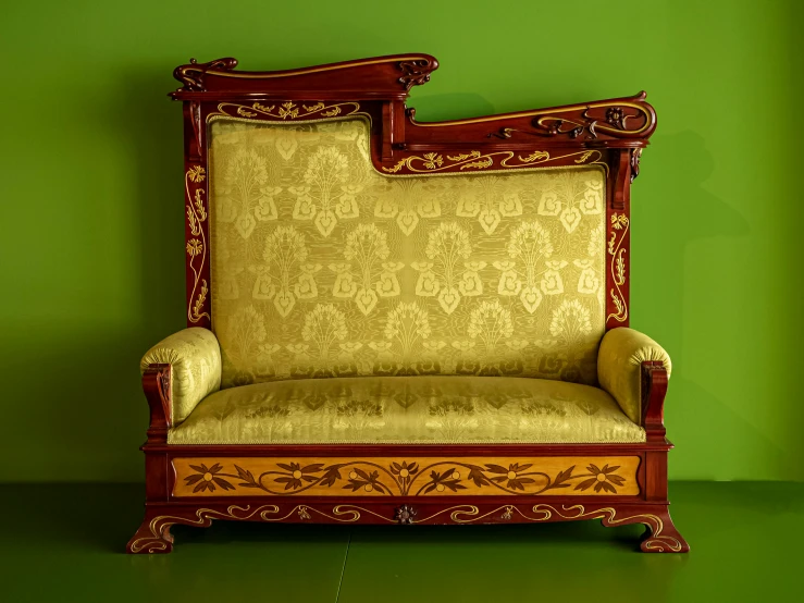 an old chair is shown against a green wall
