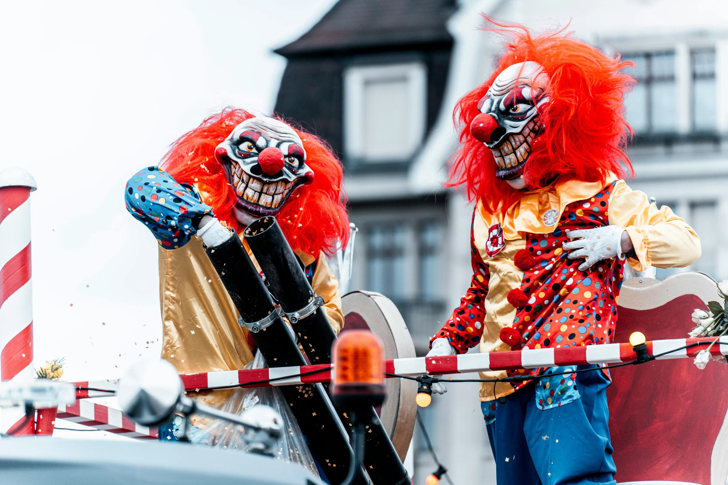 two clowns standing in the streets of a city