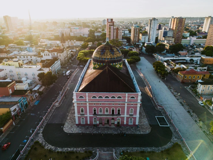 a building and street with many buildings behind it