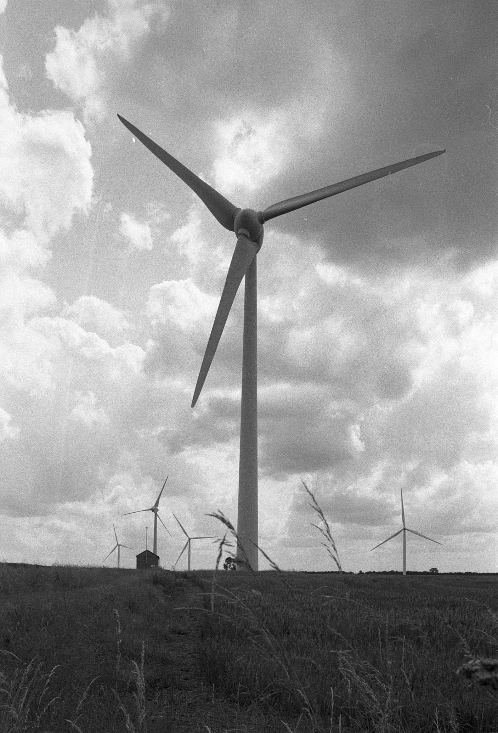 a group of windmills sitting next to each other