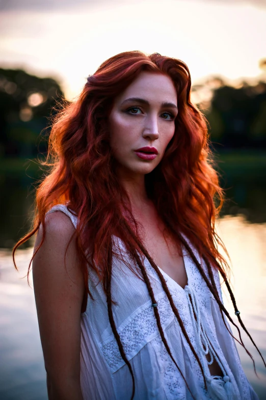 a woman standing on a body of water