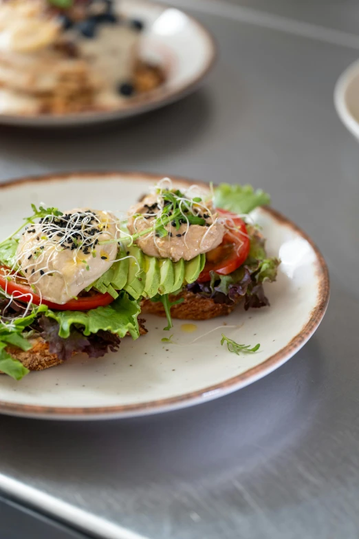 two plates holding different food items on a table