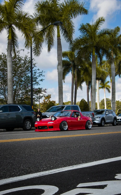 an image of several cars that are parked in the street