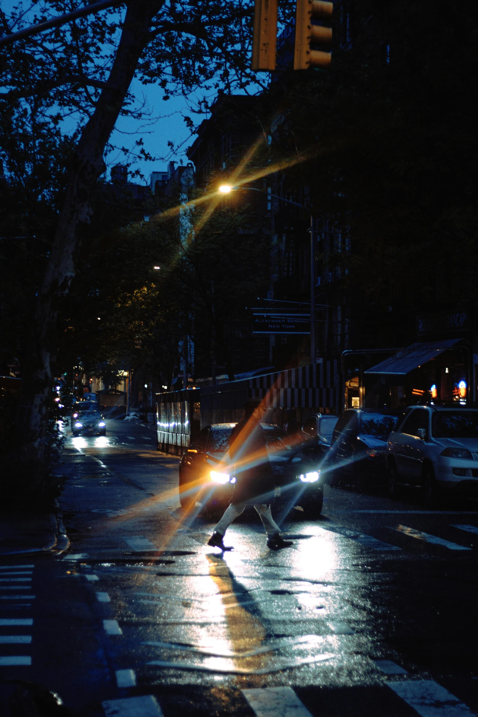 a city street filled with traffic at night