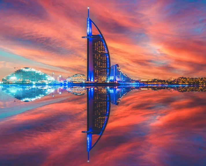 a building at night as seen from the water