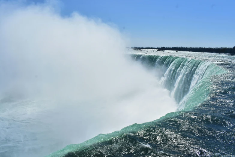 water falls as they move down and down the sides of a big waterfall