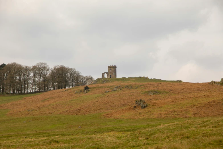 an old church on the side of a hill