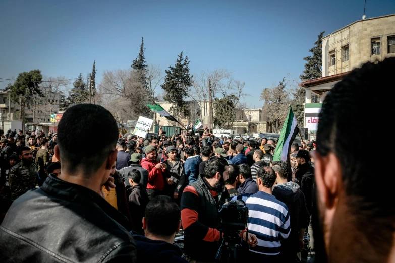 people gathered together at a demonstration organized by a group