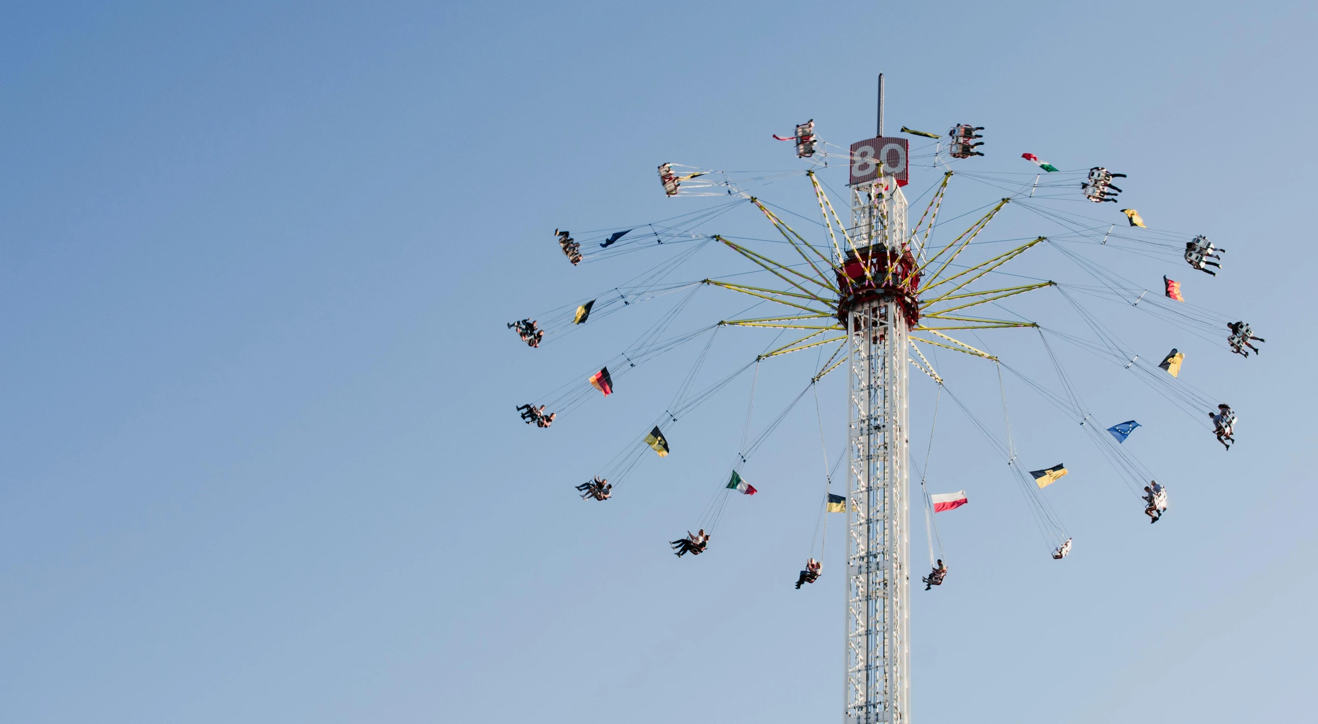 people riding on the rides at an amut park