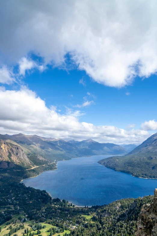 two people that are standing on a mountain top