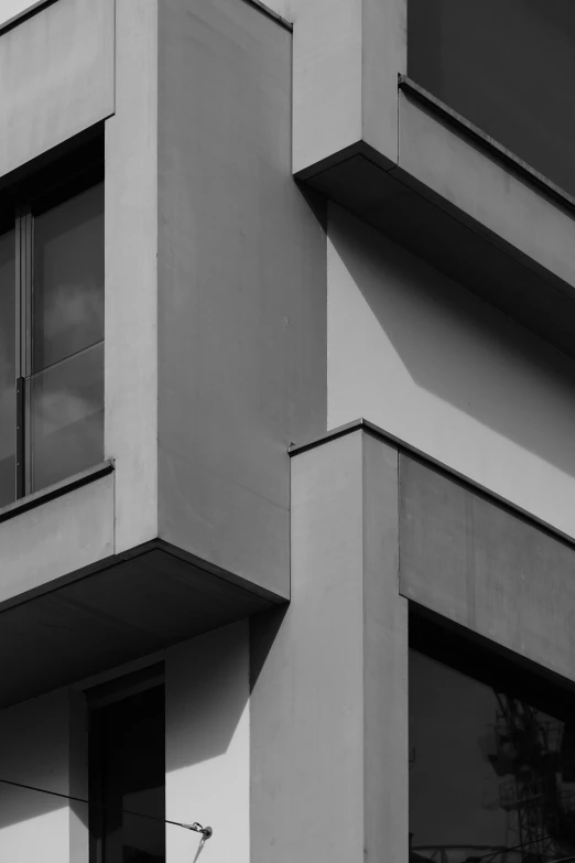 a man flying his kite in the wind on a building